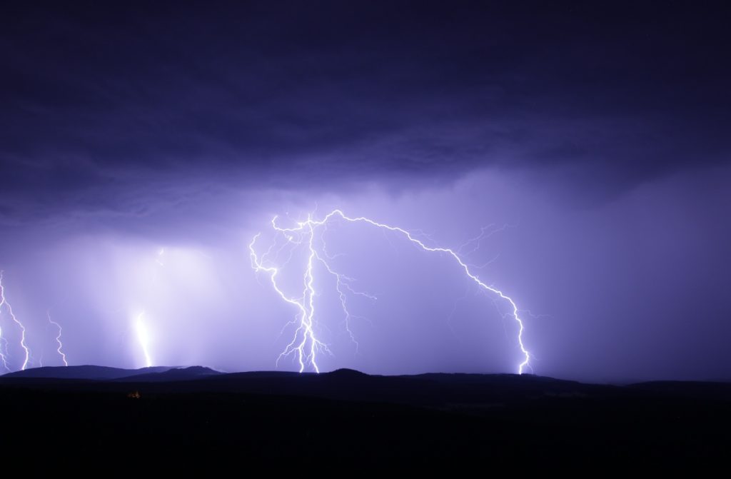 Landscape view of thunderstorm with lightning at night