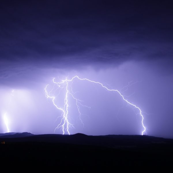 Landscape view of thunderstorm with lightning at night