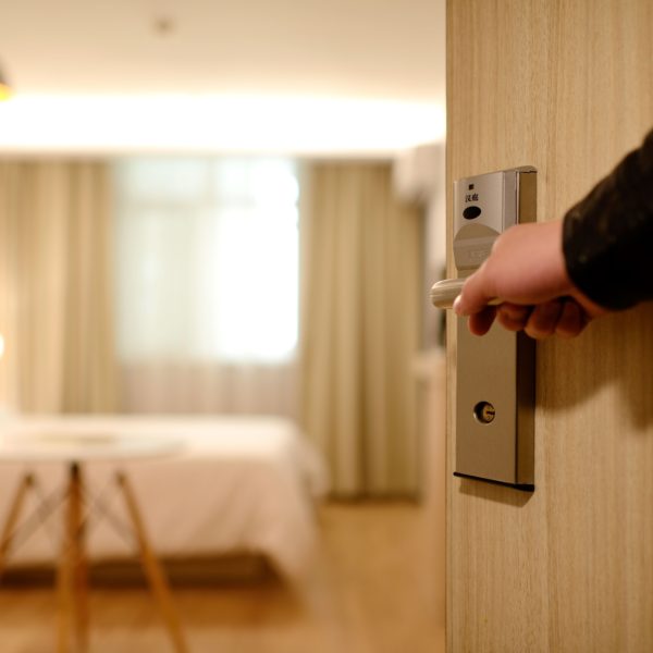 Hand opening hotel room door