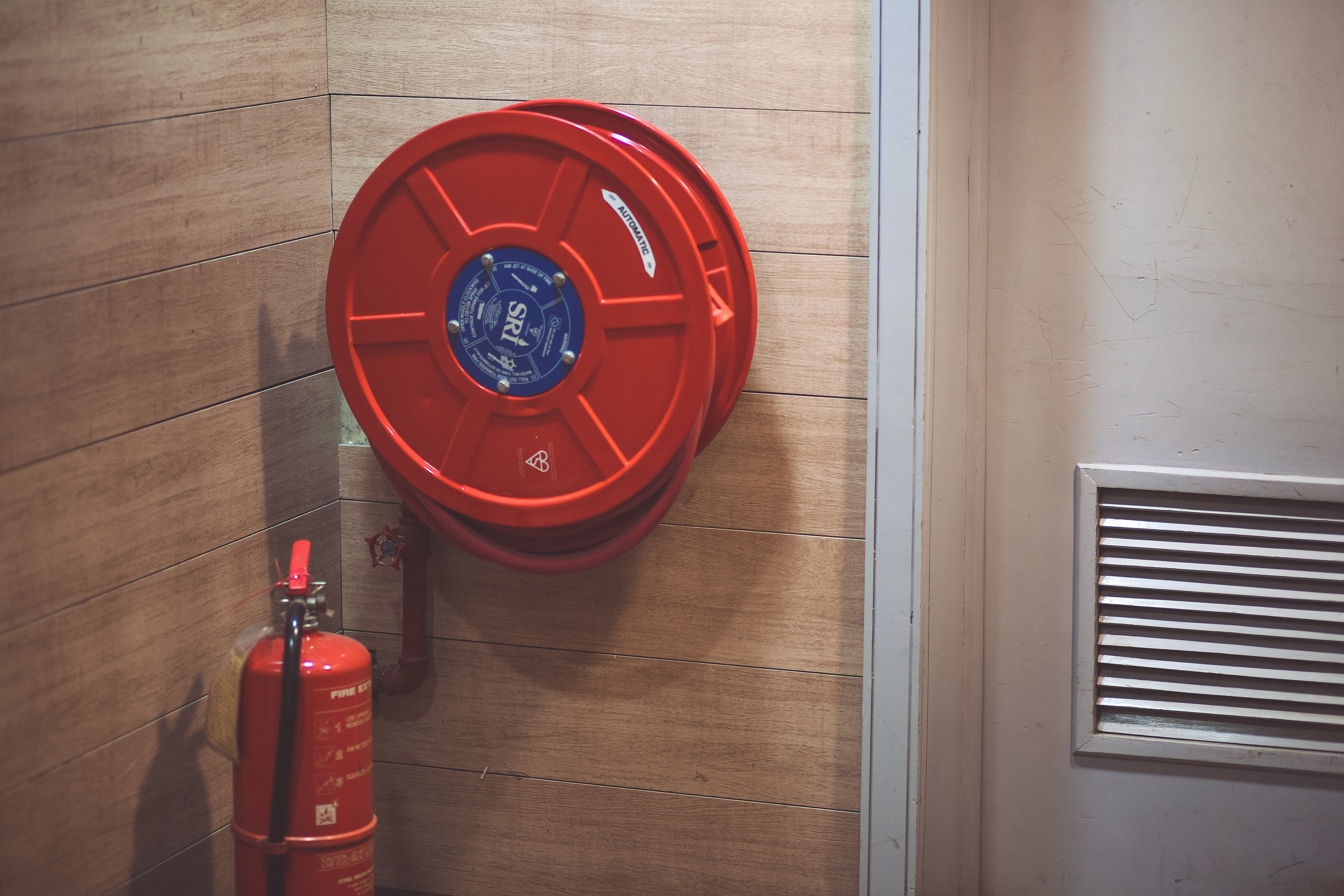 fire extinguisher and fire hose inside commercial building
