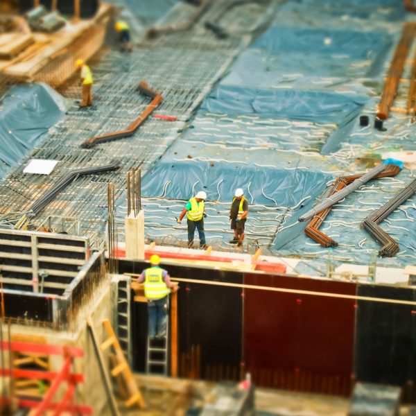 birds eye view of construction site and construction workers