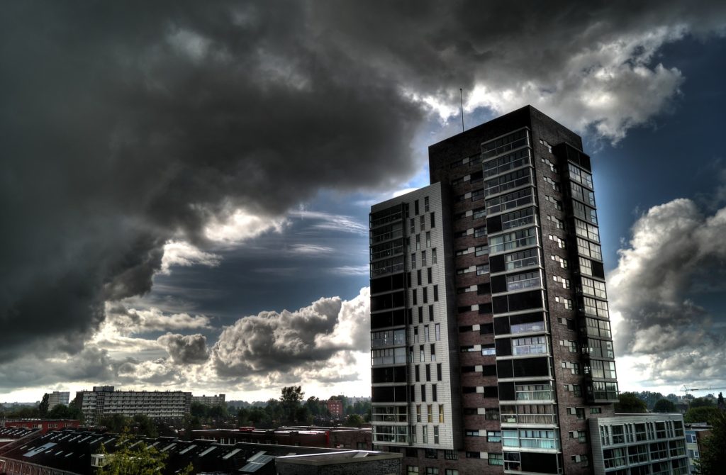 storm clouds and tall apartment building