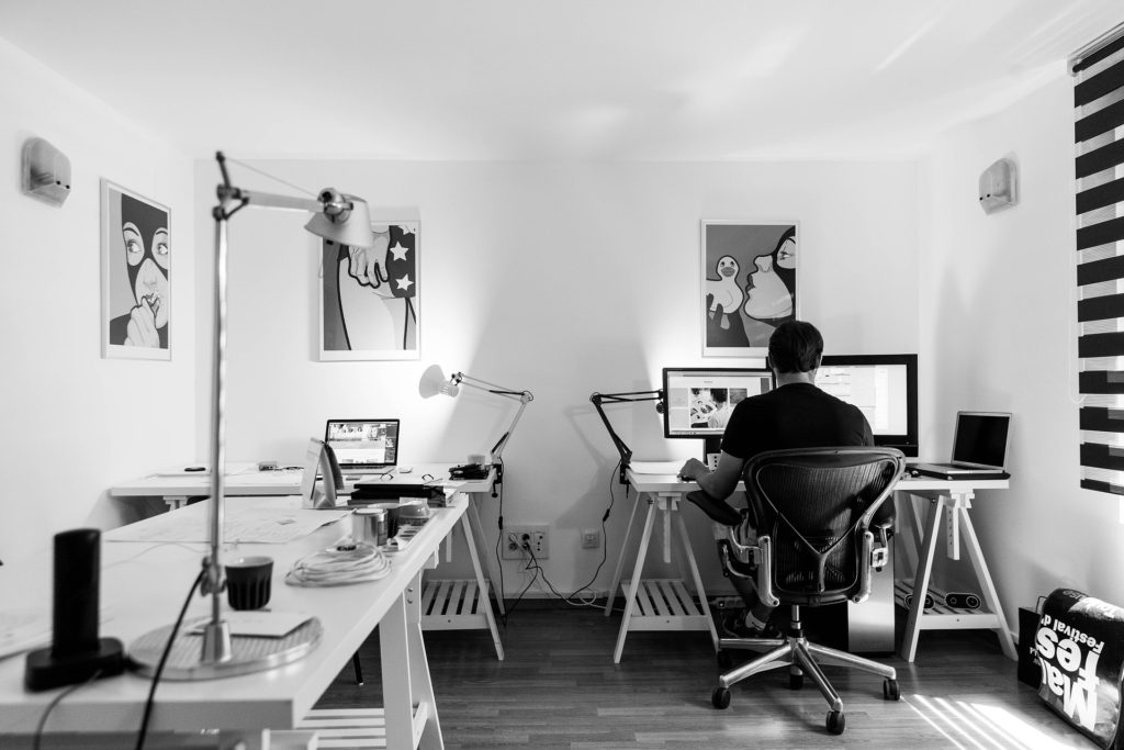 man at desk in his modern and functional home office