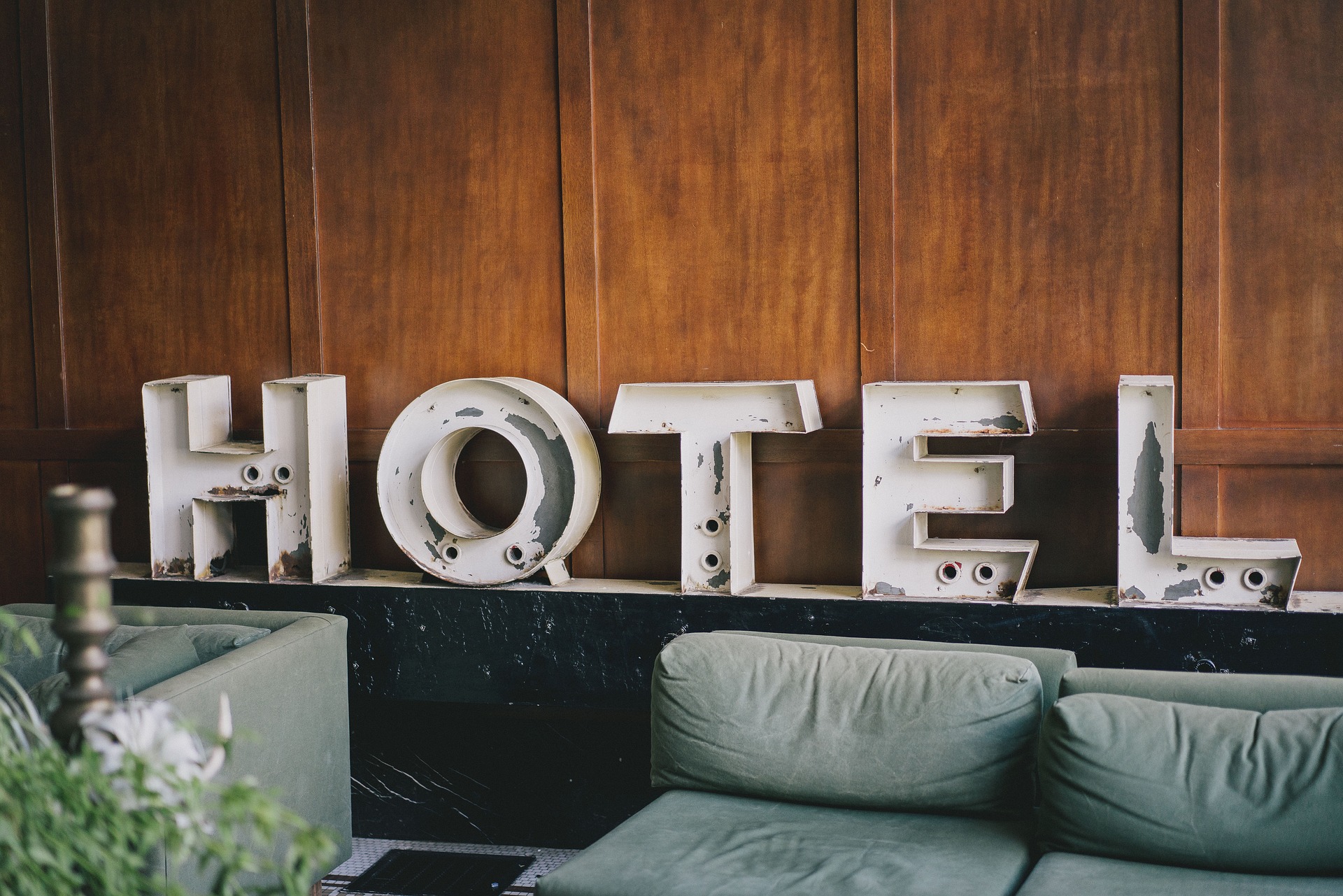 metal letters spelling out hotel in hotel lobby