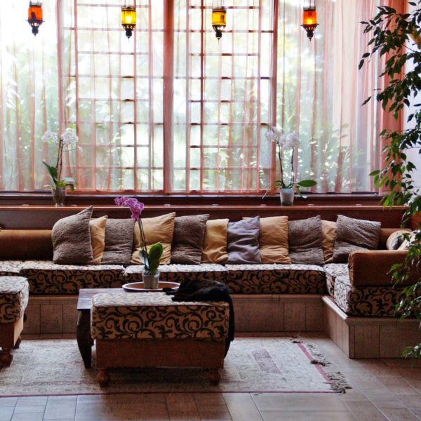 comfortable mediterranean style lobby area with lanterns and exotic couches