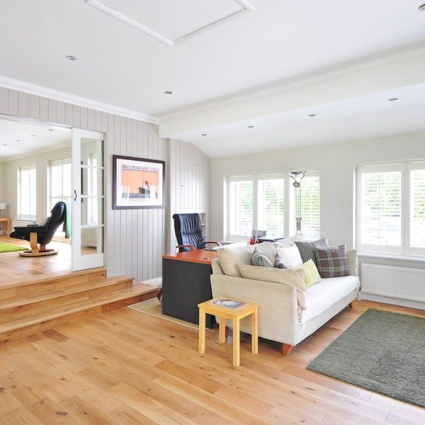 multipurpose living room, office, and play area in a home