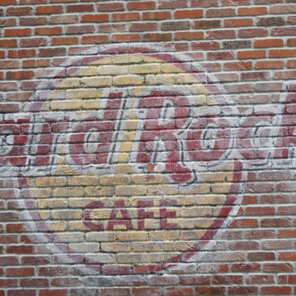 Hard Rock Cafe logo on a brick wall