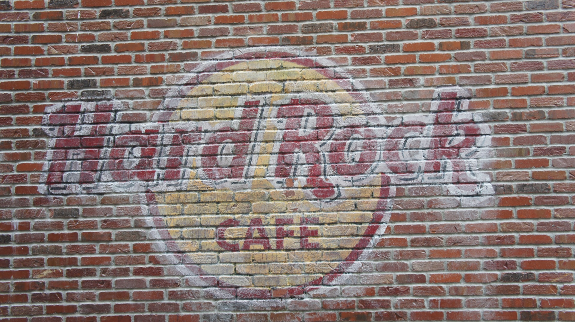 Hard Rock Cafe logo on a brick wall